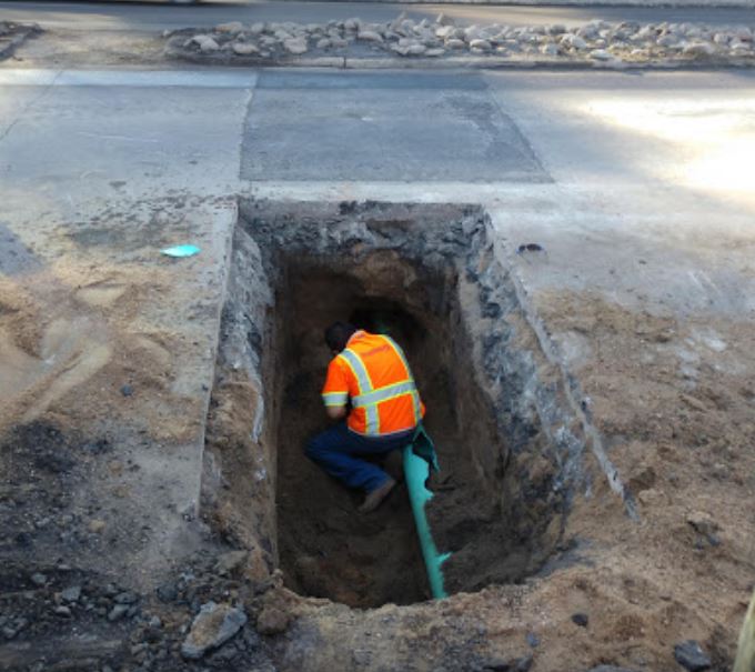 CO Excavating preforming sewer line repair.